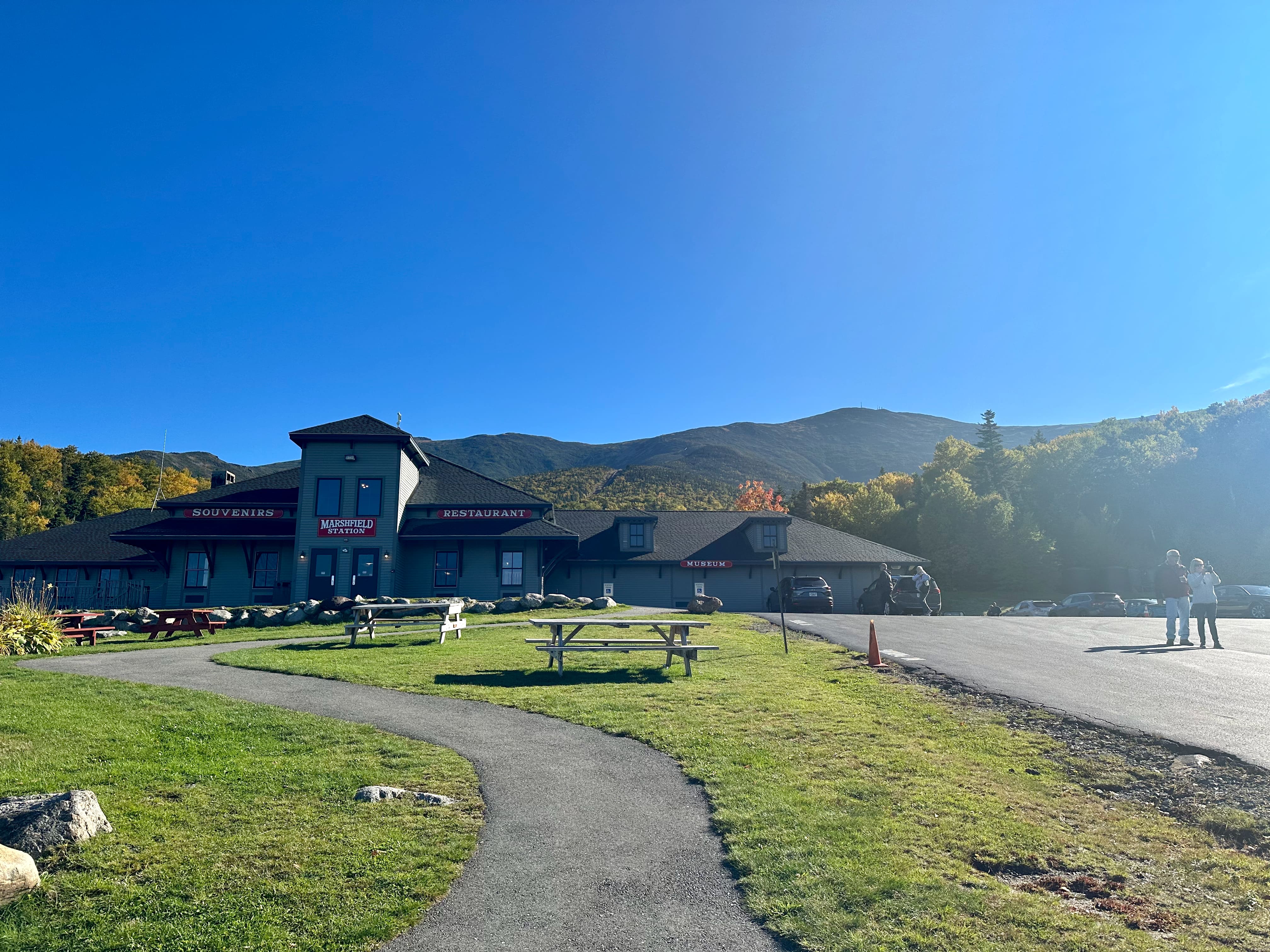 Base station of the Cog Train going up Mount Washington.  Blue skies today!